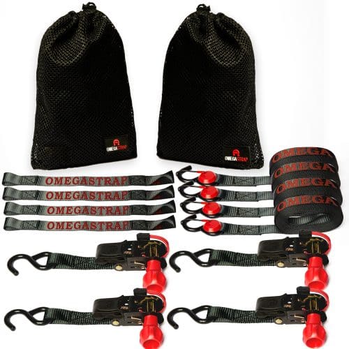The OmegaStrap® OS-2000lb 1" x 15' Ratchet Strap Tie-Down includes two sets, featuring four black straps with red hooks and the "OMEGASTRAP" text. This set also comes with two black mesh carrying bags for easy storage and tie-down solutions. - OmegaStrap - World's Greatest Ratchet Strap