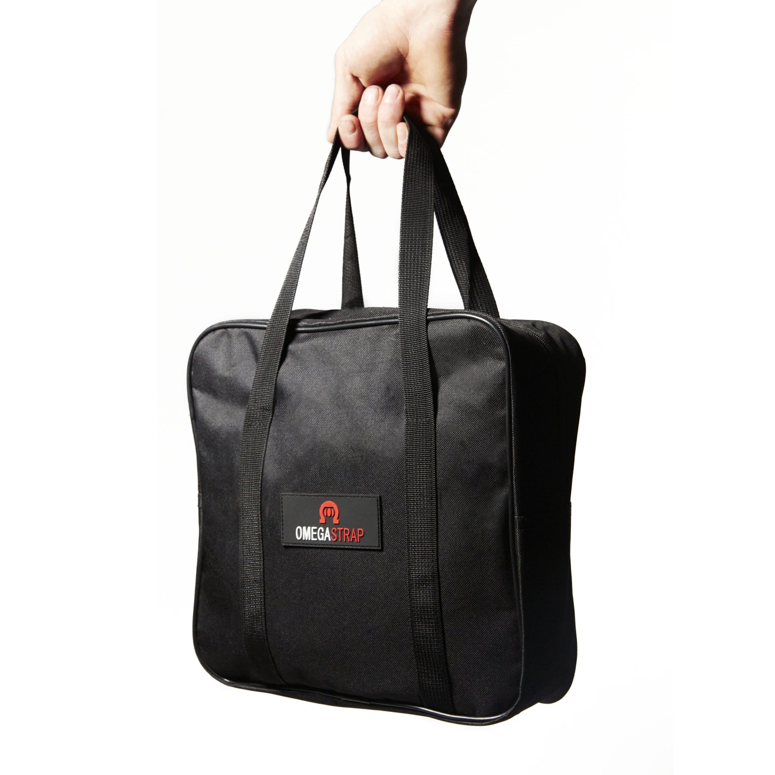Against a plain white background, a hand displays a black carrying case with handles prominently imprinted with the “OmegaStrap®” label. Its compact design is ideal for storing essentials such as the OmegaStrap® OS-35000 Tow Strap and two HD D-Ring Shackles, ensuring you’re prepared wherever you go. – OmegaStrap – World’s Greatest Ratchet Strap Against a plain white background, a hand displays a black carrying case with handles prominently imprinted with the "OmegaStrap®" label. Its compact design is ideal for storing essentials such as the OmegaStrap® OS-35000 Tow Strap and two HD D-Ring Shackles, ensuring you're prepared wherever you go. - OmegaStrap - World's Greatest Ratchet Strap